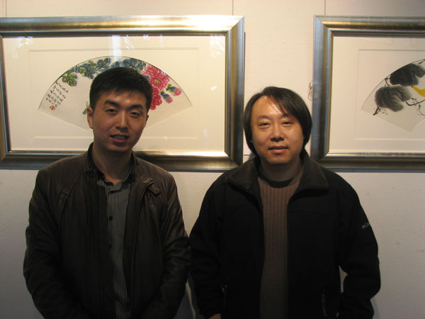 青年画家李笑天与《艺术天成》范畴部经理林少云端合影