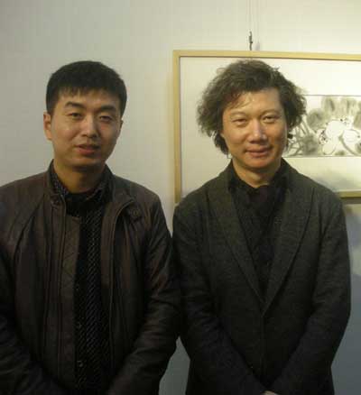 中国美术家协会《美术》杂志落实主编尚辉与《艺术天成》范畴部经理林少云端合影
