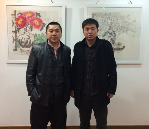 《艺术天成》范畴部经理林少云端与画展主人袁野合影