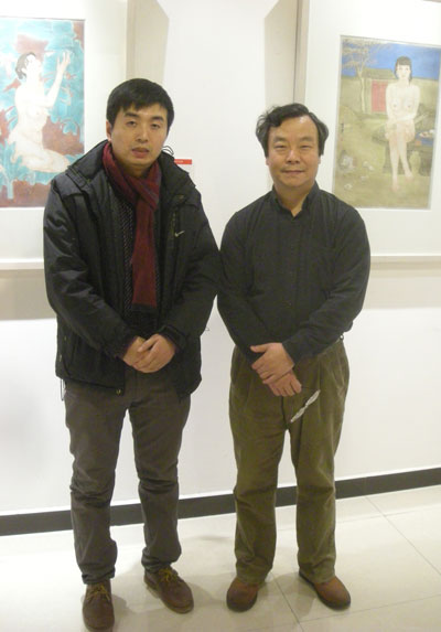 画展主人韩学中与《艺术天成》杂志社范畴部经理林少云端合影